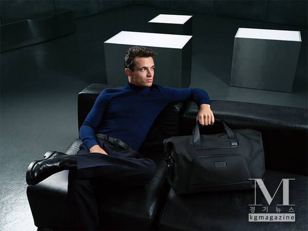 Lando Norris pictured with the Alpha Double Expansion Duffel in Black.